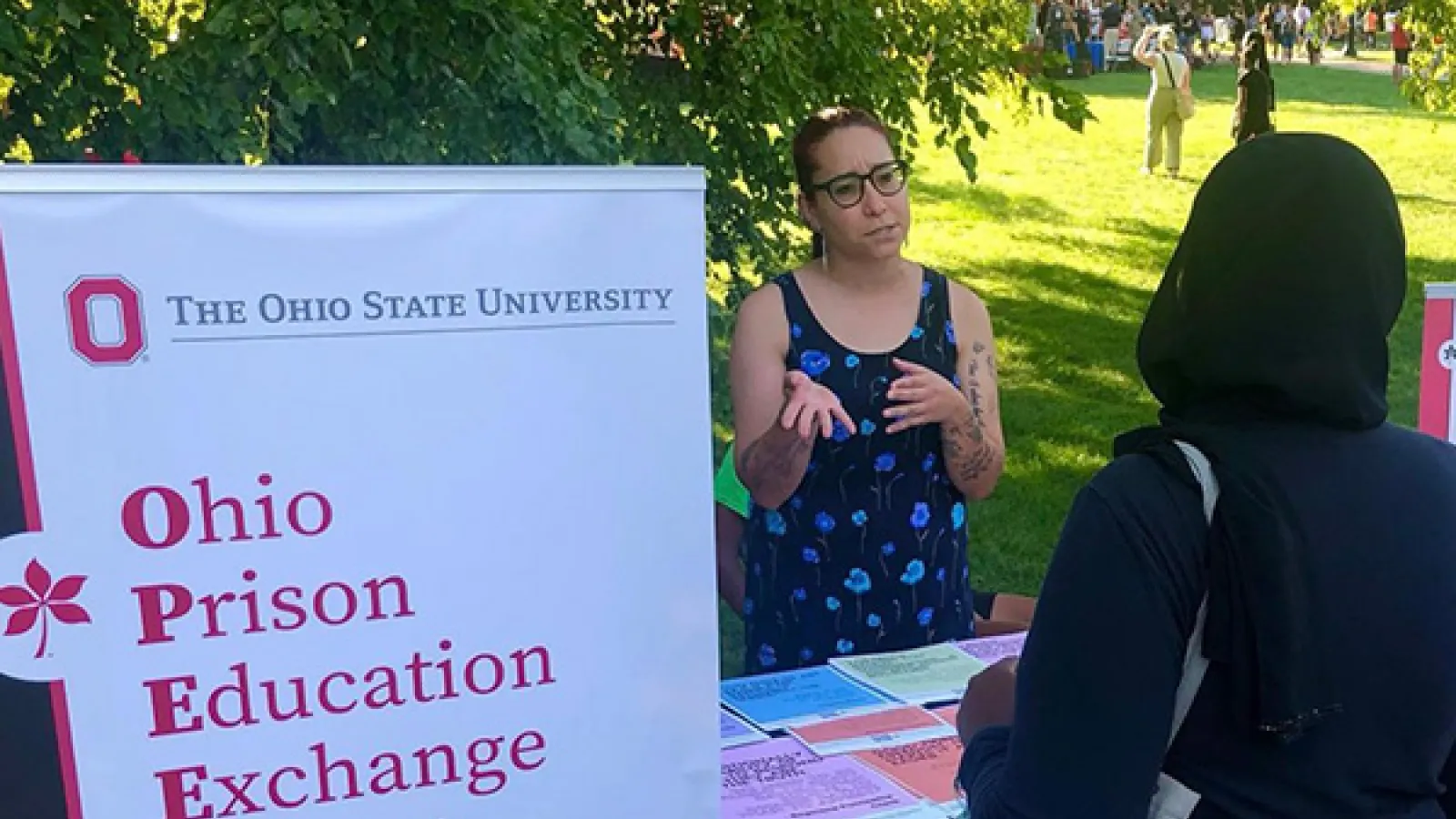 OPEEP Program Coordinator Babette Cieskowski speaks with a student at the Columbus campus student involvement fair.